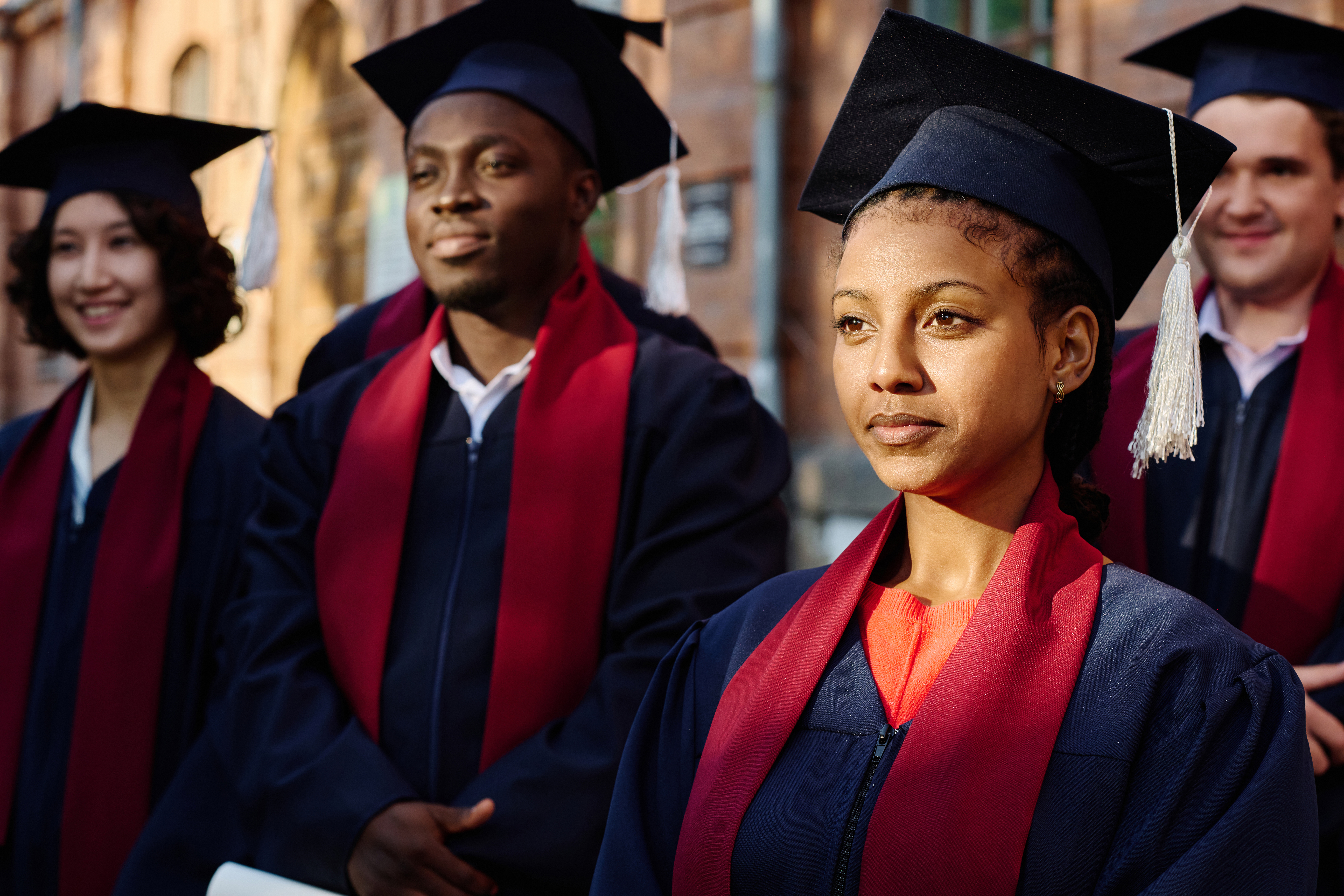 Graduates in caps and gowns at a commencement ceremony