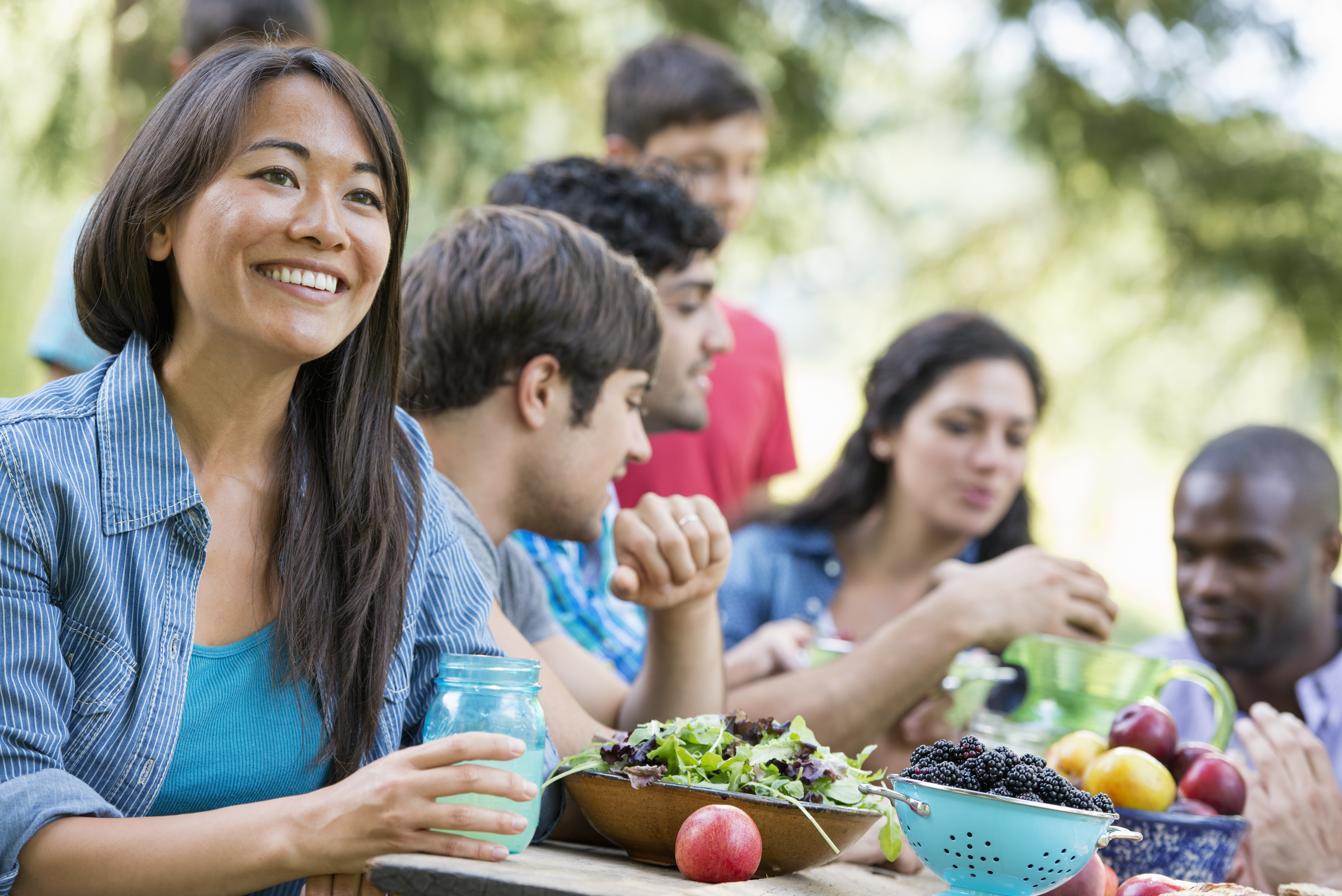Community members sharing a healthy meal together outdoors